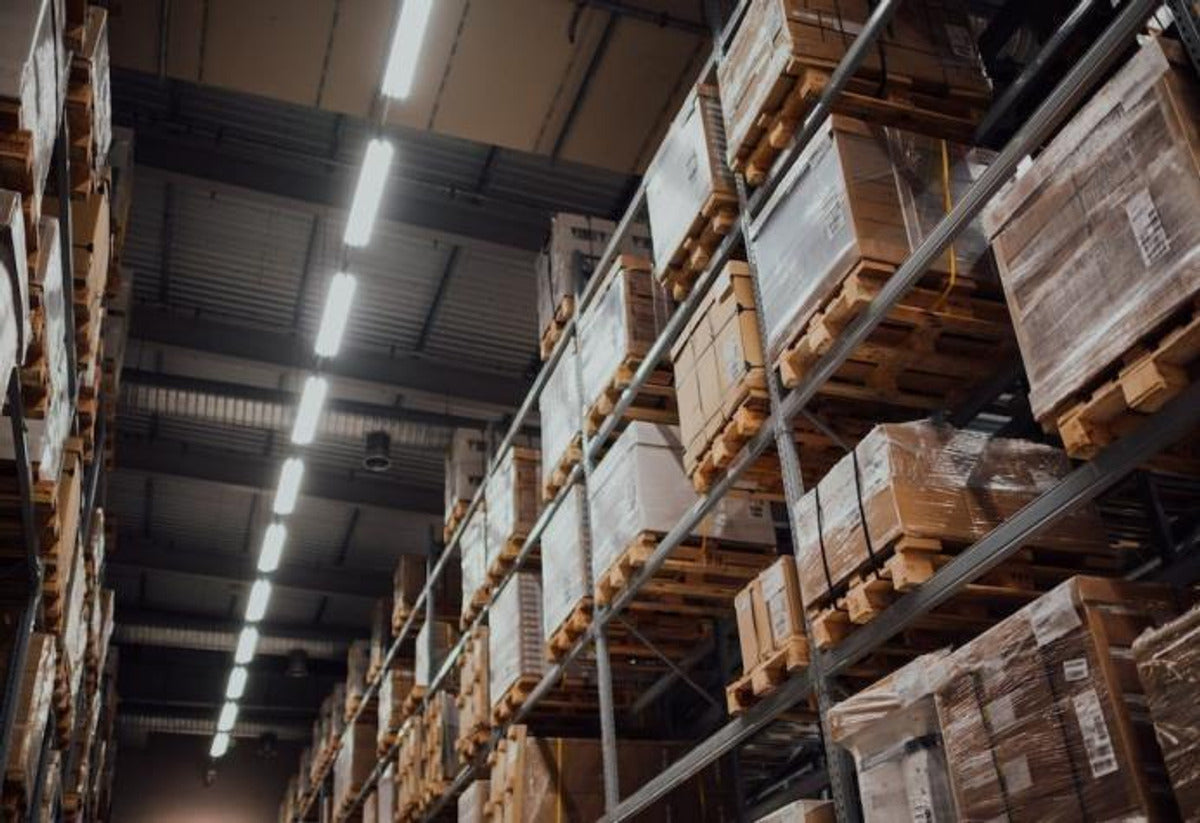 Illustrative warehouse application scene for Honya linear high bay lighting
