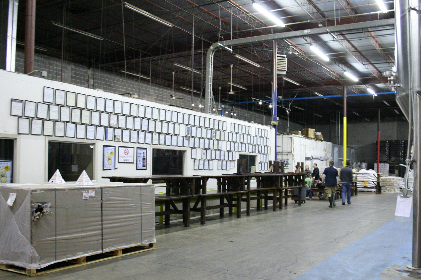 Industrial warehouse aisle lit with commercial LED high bay fixtures